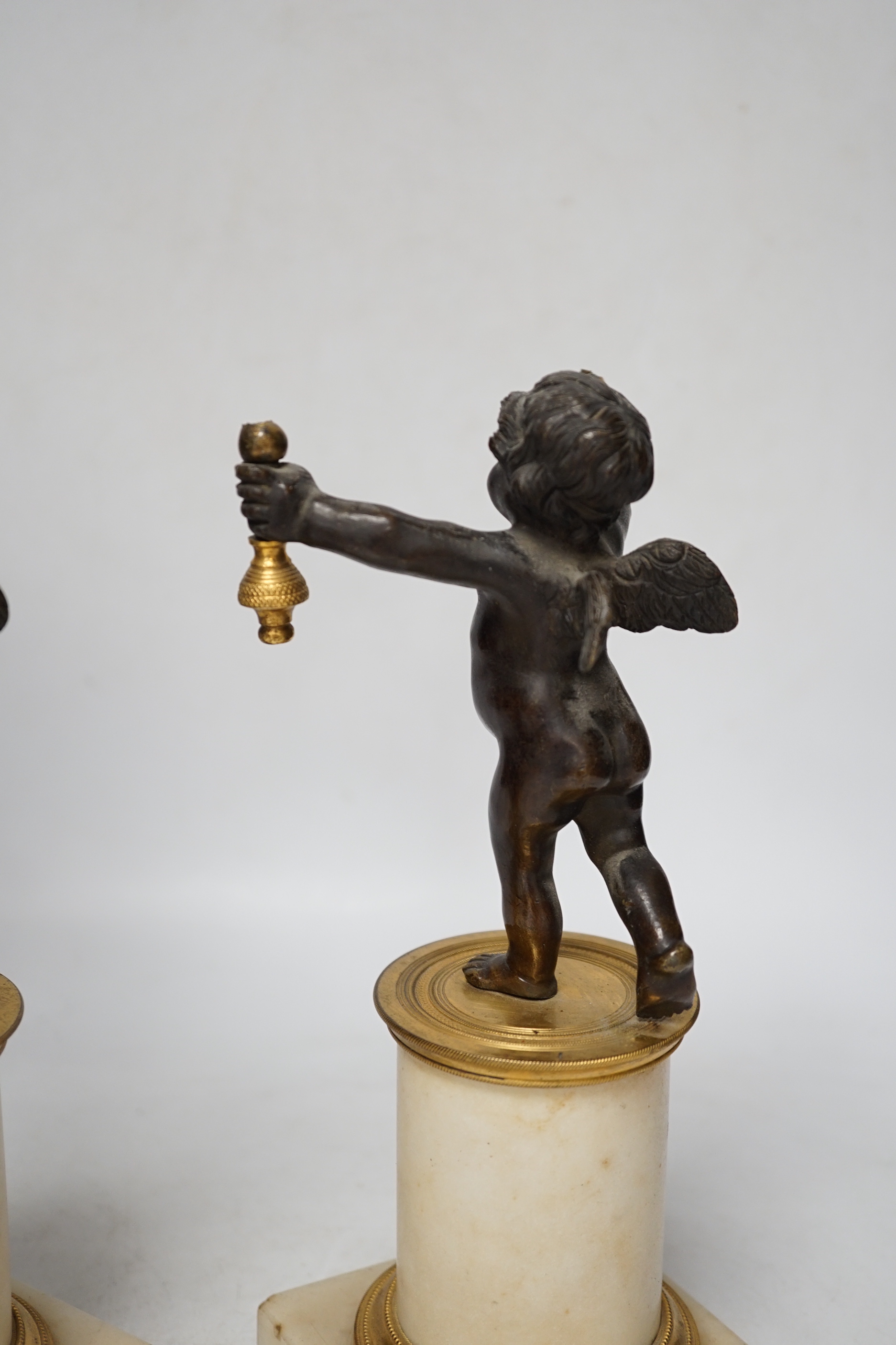 A pair of Louis XVI style bronze, ormolu and alabaster cherub lamps, 42cm high (one a.f.)